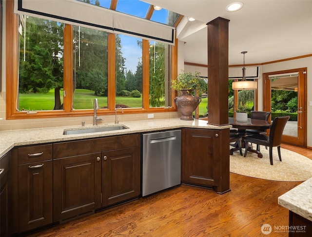 2805 Sahalee Dr E, Sammamish, WA 98074 - kitchen with stainless steel dishwasher, wood finished floors, dark brown cabinetry, healthy amount of natural light, and crown molding