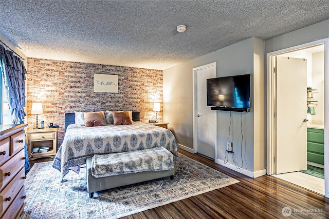 5613 89th Ave W, University Place, WA 98467 - bedroom featuring a textured ceiling, wood finished floors, baseboards, and brick wall