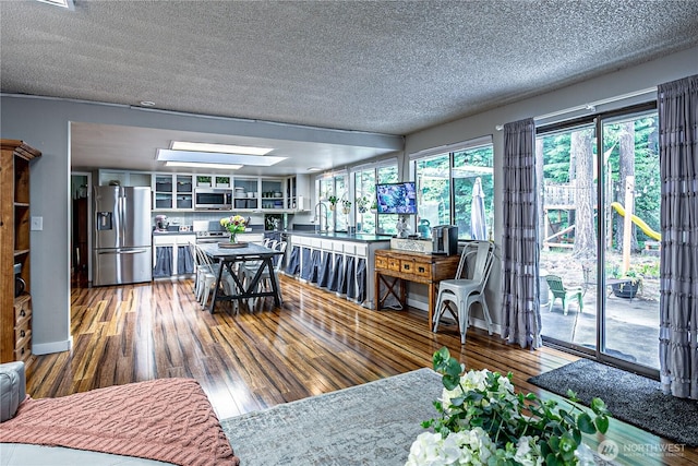 5613 89th Ave W, University Place, WA 98467 - dining room with a textured ceiling and wood finished floors