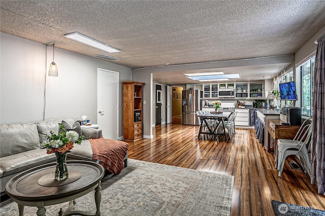 5613 89th Ave W, University Place, WA 98467 - living area with hardwood / wood-style flooring and a textured ceiling
