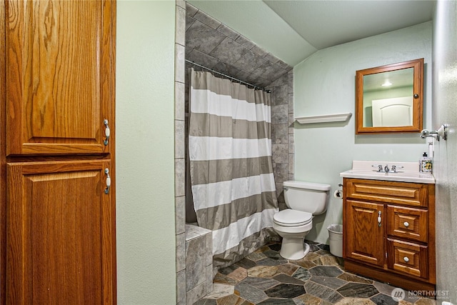 5613 89th Ave W, University Place, WA 98467 - full bathroom with vanity, stone finish flooring, vaulted ceiling, toilet, and a shower with shower curtain