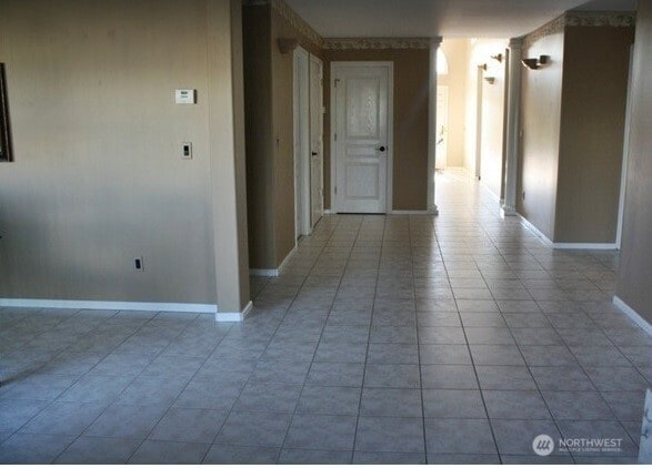 8122 Coquitlam Pl, Blaine, WA 98230 - hall featuring tile patterned flooring and baseboards