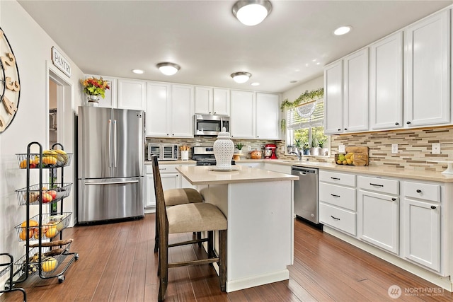 813 SW 363rd Pl, Federal Way, WA 98023 - kitchen with stainless steel appliances, white cabinets, light countertops, dark wood-style floors, and recessed lighting