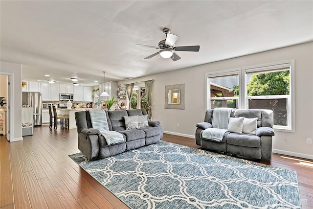 813 SW 363rd Pl, Federal Way, WA 98023 - living area with ceiling fan, dark wood-style flooring, and baseboards