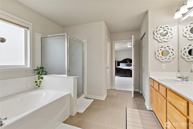 813 SW 363rd Pl, Federal Way, WA 98023 - bathroom with vanity, a shower stall, a bath, and baseboards