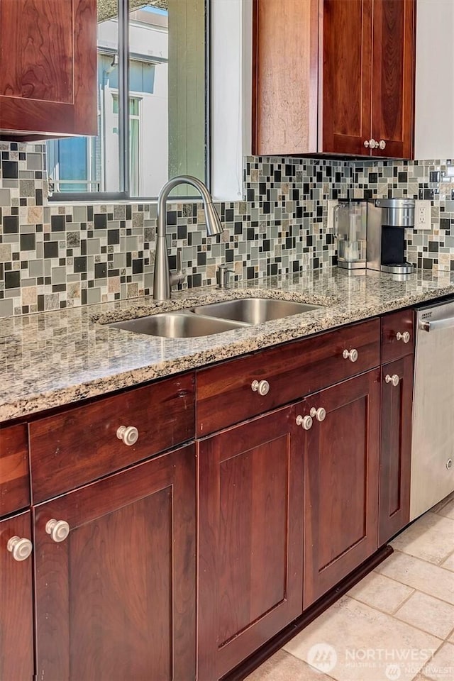 4561 Lake Washington Blvd NE Unit 303, Kirkland, WA 98033 - kitchen with stainless steel dishwasher, a sink, decorative backsplash, and light stone countertops