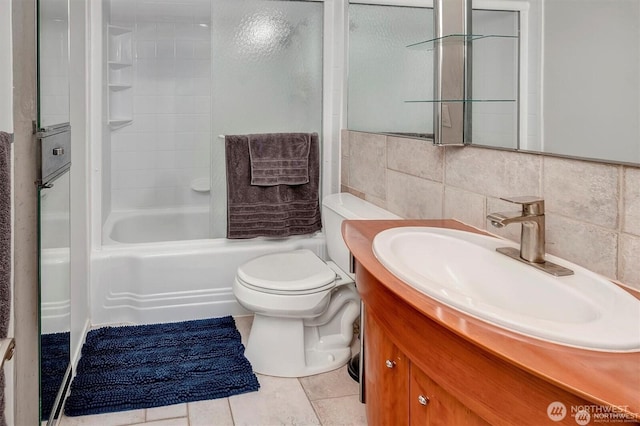 4561 Lake Washington Blvd NE Unit 303, Kirkland, WA 98033 - bathroom with vanity, toilet, tile patterned floors, washtub / shower combination, and backsplash