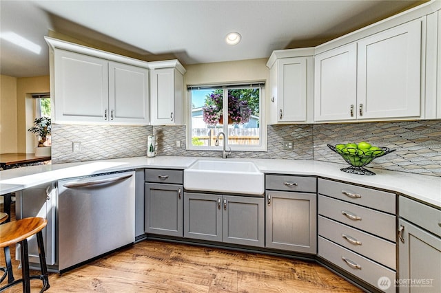300 Fircrest Dr, Sequim, WA 98382 - kitchen featuring gray cabinetry, dishwasher, a sink, light countertops, and plenty of natural light