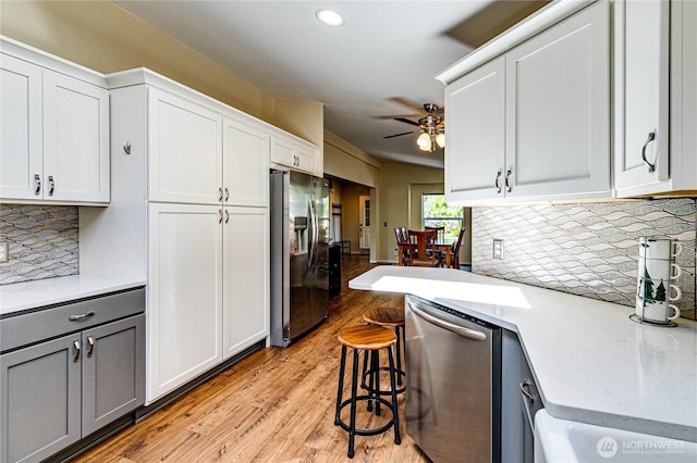 300 Fircrest Dr, Sequim, WA 98382 - kitchen featuring stainless steel appliances, ceiling fan, gray cabinetry, recessed lighting, and backsplash
