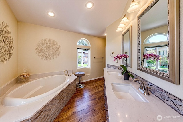 300 Fircrest Dr, Sequim, WA 98382 - bathroom with healthy amount of natural light, a bath, wood finished floors, double vanity, and recessed lighting