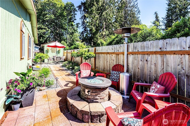 300 Fircrest Dr, Sequim, WA 98382 - fenced backyard with an outdoor fire pit and a patio area