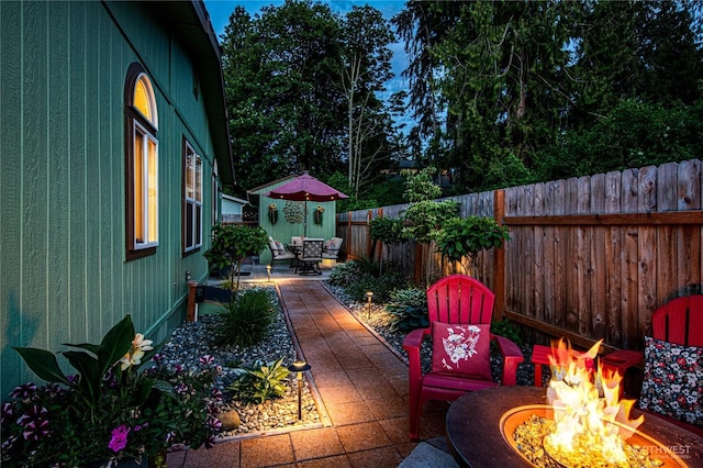 300 Fircrest Dr, Sequim, WA 98382 - deck with a fire pit, a patio area, and a fenced backyard