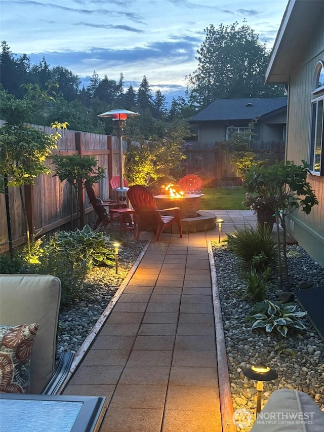 300 Fircrest Dr, Sequim, WA 98382 - patio terrace at dusk featuring a fire pit and a patio
