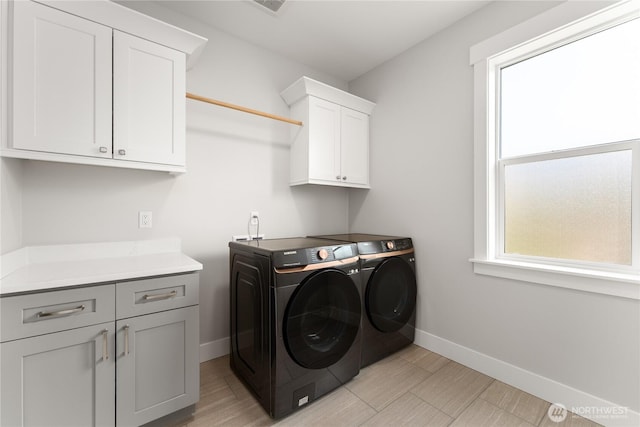 200 Pinnacle Pl, Chelan, WA 98816 - laundry room featuring cabinet space, washing machine and dryer, baseboards, and light wood-type flooring
