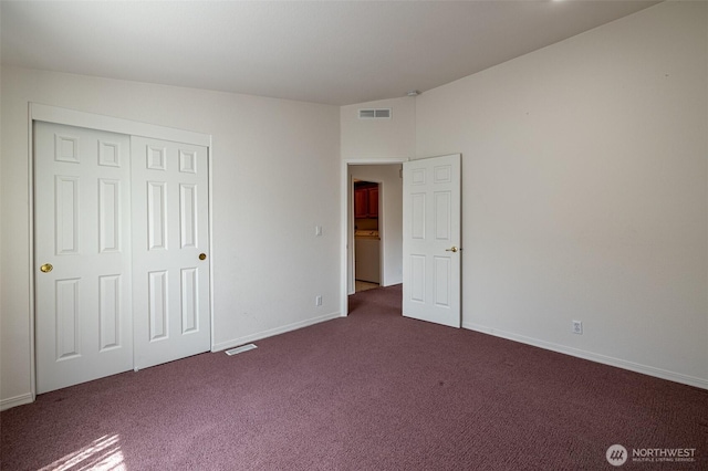 580 Canyon Dr, East Wenatchee, WA 98802 - unfurnished bedroom featuring dark carpet and a closet