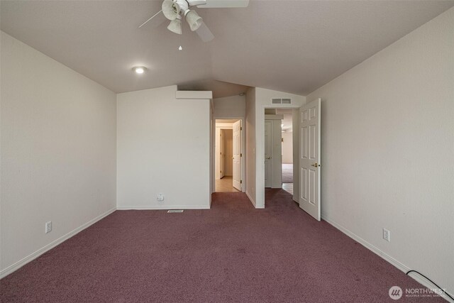580 Canyon Dr, East Wenatchee, WA 98802 - unfurnished bedroom with dark colored carpet, vaulted ceiling, and ceiling fan