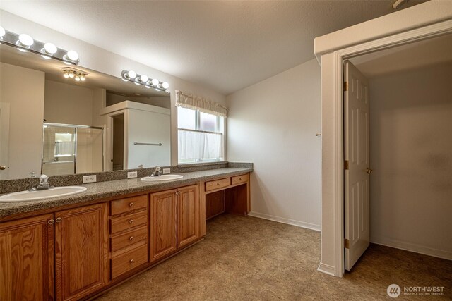 580 Canyon Dr, East Wenatchee, WA 98802 - bathroom with double vanity, a stall shower, and vaulted ceiling
