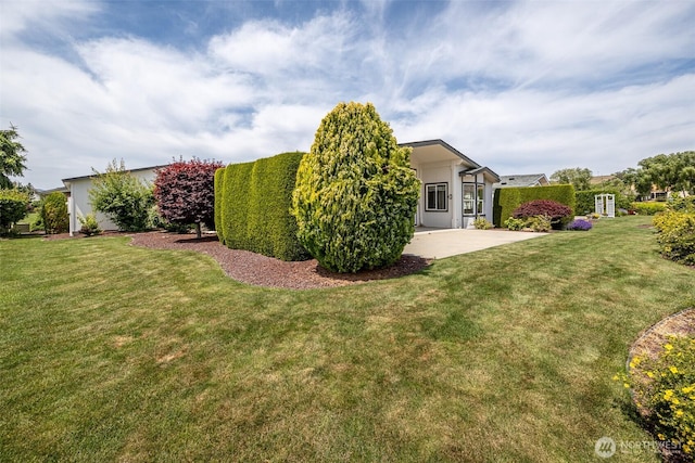 580 Canyon Dr, East Wenatchee, WA 98802 - view of green lawn with a patio
