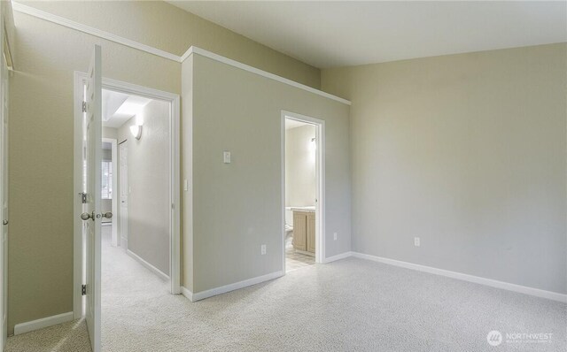 13145 102nd Ln NE Unit 5, Kirkland, WA 98034 - spare room featuring light colored carpet and baseboards
