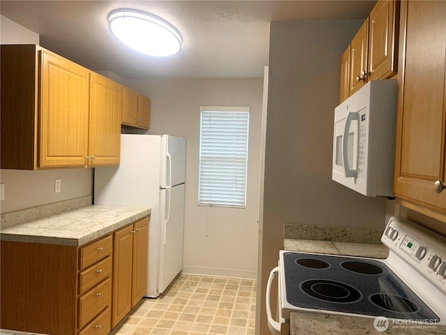 13145 102nd Ln NE Unit 5, Kirkland, WA 98034 - kitchen featuring white appliances, light countertops, and baseboards