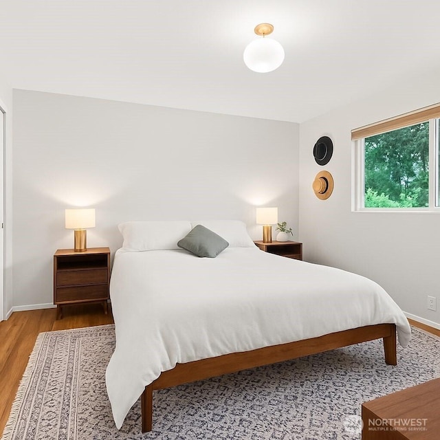 1030 145th Pl SE, Bellevue, WA 98007 - bedroom featuring wood finished floors and baseboards
