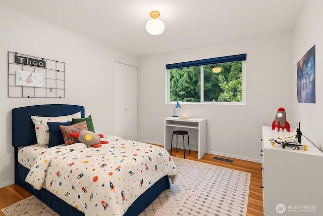 1030 145th Pl SE, Bellevue, WA 98007 - bedroom with light wood-style floors and baseboards
