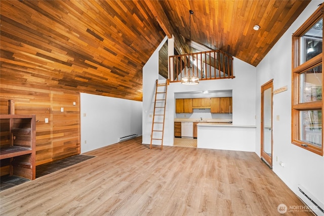 17118 Riverview Way E, Enumclaw, WA 98022 - unfurnished living room with a baseboard radiator, high vaulted ceiling, light wood-style flooring, baseboard heating, and a chandelier