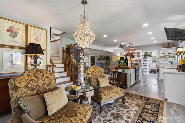 10 E Sunny Sands Rd, Cathlamet, WA 98612 - living area featuring a ceiling fan, a chandelier, wood finished floors, recessed lighting, and stairs
