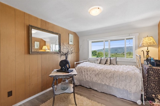 10 E Sunny Sands Rd, Cathlamet, WA 98612 - bedroom featuring wood finished floors and wood walls