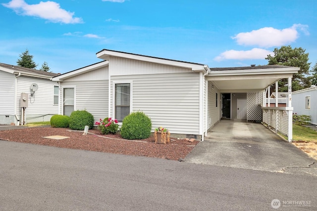 2611 S 288th St Unit 61, Federal Way, WA 98003 - view of front of house featuring driveway, a carport, and crawl space