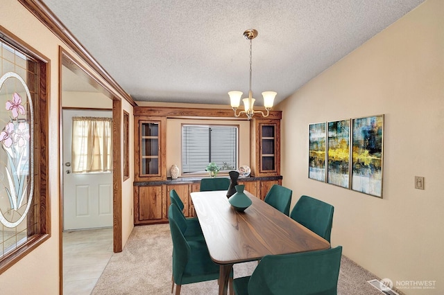2611 S 288th St Unit 61, Federal Way, WA 98003 - dining space with a textured ceiling and a chandelier