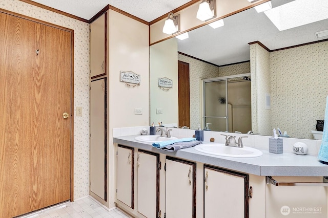 2611 S 288th St Unit 61, Federal Way, WA 98003 - full bath featuring crown molding, wallpapered walls, a shower stall, double vanity, and a skylight