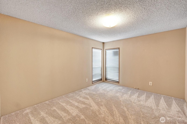 2611 S 288th St Unit 61, Federal Way, WA 98003 - spare room featuring carpet flooring and a textured ceiling