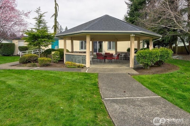 2611 S 288th St Unit 61, Federal Way, WA 98003 - rear view of house with a gazebo, roof with shingles, and a lawn