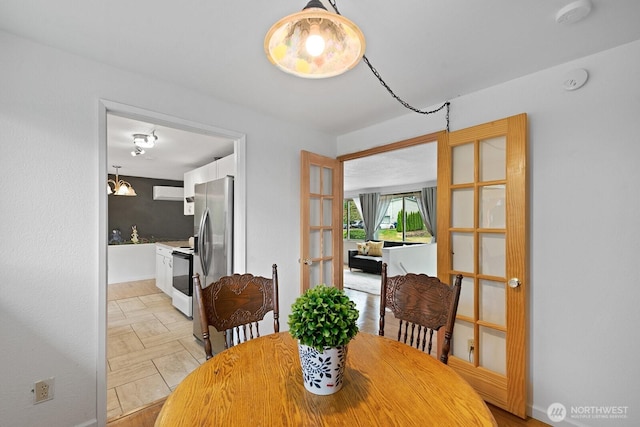 2433 199th Pl SW, Lynnwood, WA 98036 - dining room featuring french doors and baseboards