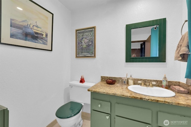 15370 62nd Ave S Unit B4, Tukwila, WA 98118 - bathroom featuring vanity, toilet, and baseboards