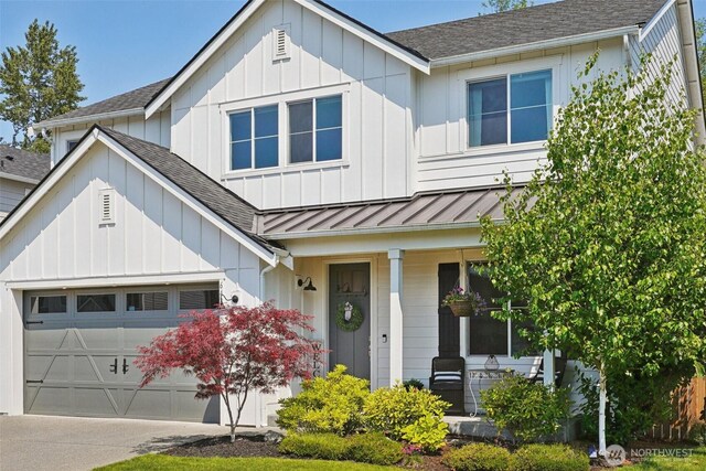 648 S Davis St, Buckley, WA 98321 - view of front of property with covered porch, roof with shingles, concrete driveway, a garage, and a standing seam roof
