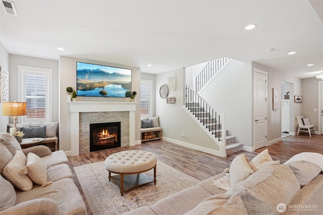 648 S Davis St, Buckley, WA 98321 - living room with stairway, wood finished floors, a fireplace, recessed lighting, and baseboards