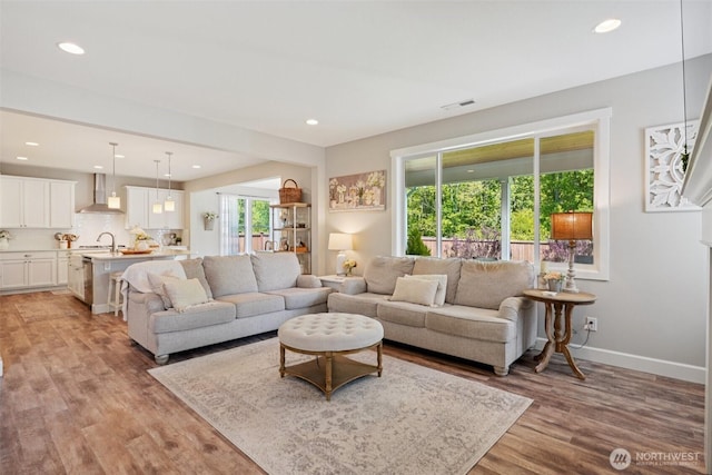 648 S Davis St, Buckley, WA 98321 - living room with light wood-style floors, recessed lighting, and baseboards