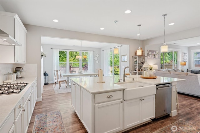 648 S Davis St, Buckley, WA 98321 - kitchen featuring appliances with stainless steel finishes, a sink, healthy amount of natural light, recessed lighting, and wood finished floors