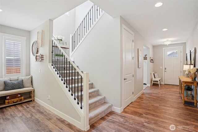648 S Davis St, Buckley, WA 98321 - stairs with wood finished floors, baseboards, and recessed lighting