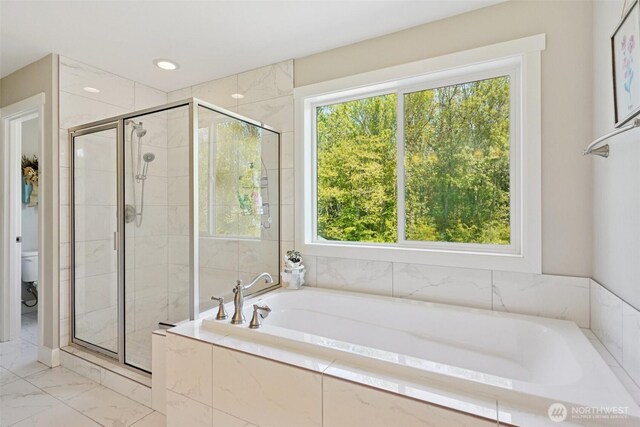 648 S Davis St, Buckley, WA 98321 - full bathroom featuring a stall shower, toilet, a garden tub, and marble look tile flooring