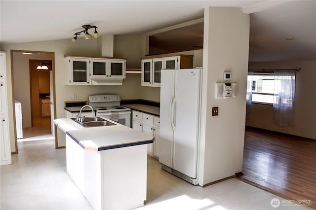 3060 NE Mcwilliams Rd Unit 54, Bremerton, WA 98311 - kitchen featuring white appliances, a sink, under cabinet range hood, white cabinetry, and a center island with sink