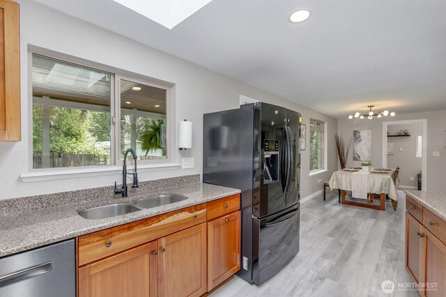 1728 106th St SW, Everett, WA 98204 - kitchen featuring black refrigerator with ice dispenser, a sink, dishwasher, light wood-style flooring, and a chandelier