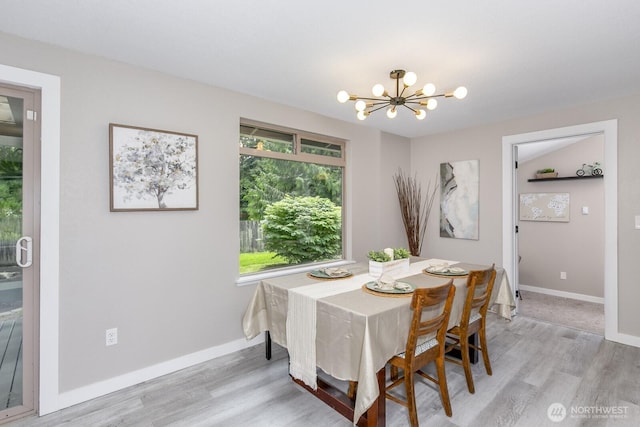 1728 106th St SW, Everett, WA 98204 - dining space featuring a chandelier, light wood-style flooring, and baseboards