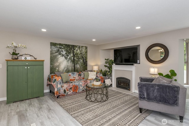 1728 106th St SW, Everett, WA 98204 - living room featuring light wood finished floors, a tiled fireplace, recessed lighting, and baseboards
