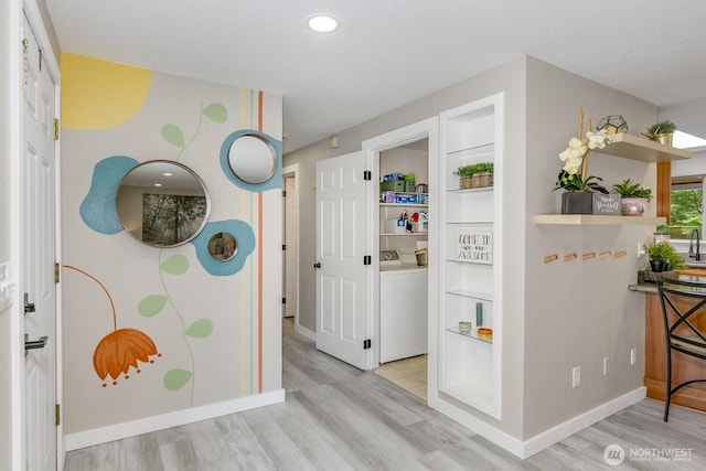 1728 106th St SW, Everett, WA 98204 - corridor featuring washer / dryer, wood finished floors, baseboards, recessed lighting, and built in shelves