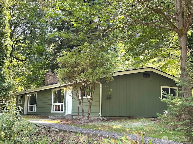 3305 Windolph Ln NW, Olympia, WA 98502 - view of side of property featuring a chimney