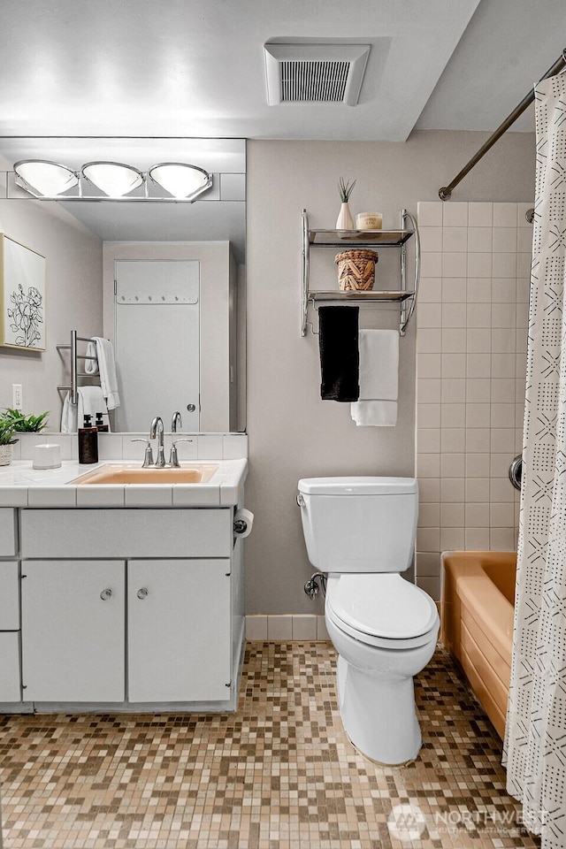 919 2nd Ave W Unit 103, Seattle, WA 98119 - full bathroom featuring vanity, shower / bath combo, and tile patterned floors