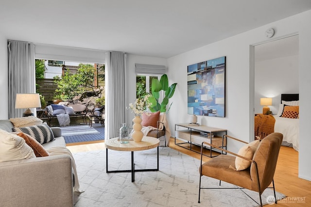 919 2nd Ave W Unit 103, Seattle, WA 98119 - living area featuring light wood-type flooring and plenty of natural light
